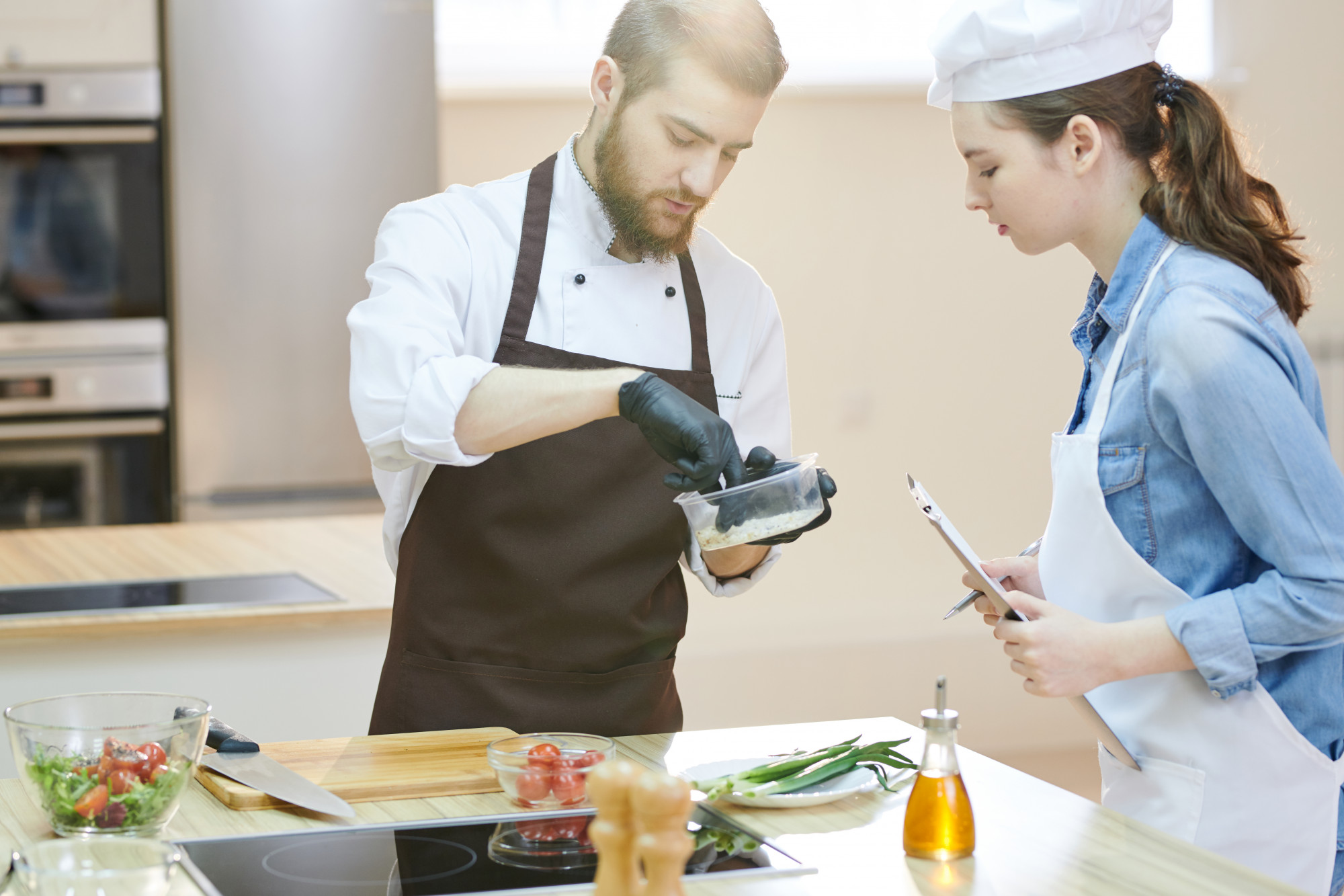 studio chef testing a dish on counter